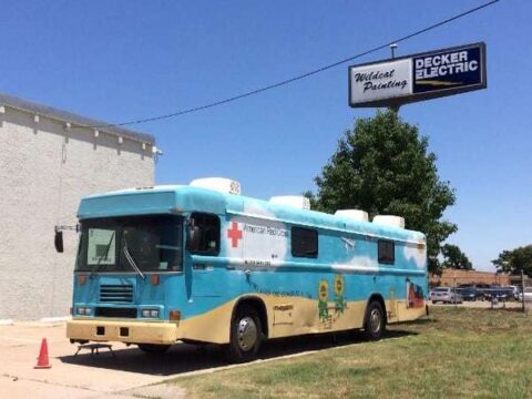 American Red Cross blood drive bus parked outside of Decker Electric's Wichita building