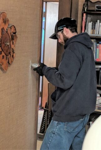 photo of Decker Electric technician installing lighting inside a home