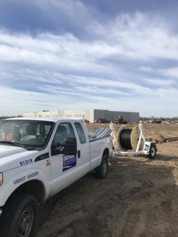 Construction site with Decker Electric team & truck