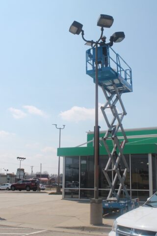 boom lift for Decker Electric electrician to work on parking lot lighting