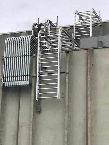 exterior of plant with ladder for techs to access the upper areas