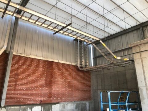 ladder walkway inside large facility for Decker Electric electricians to do work