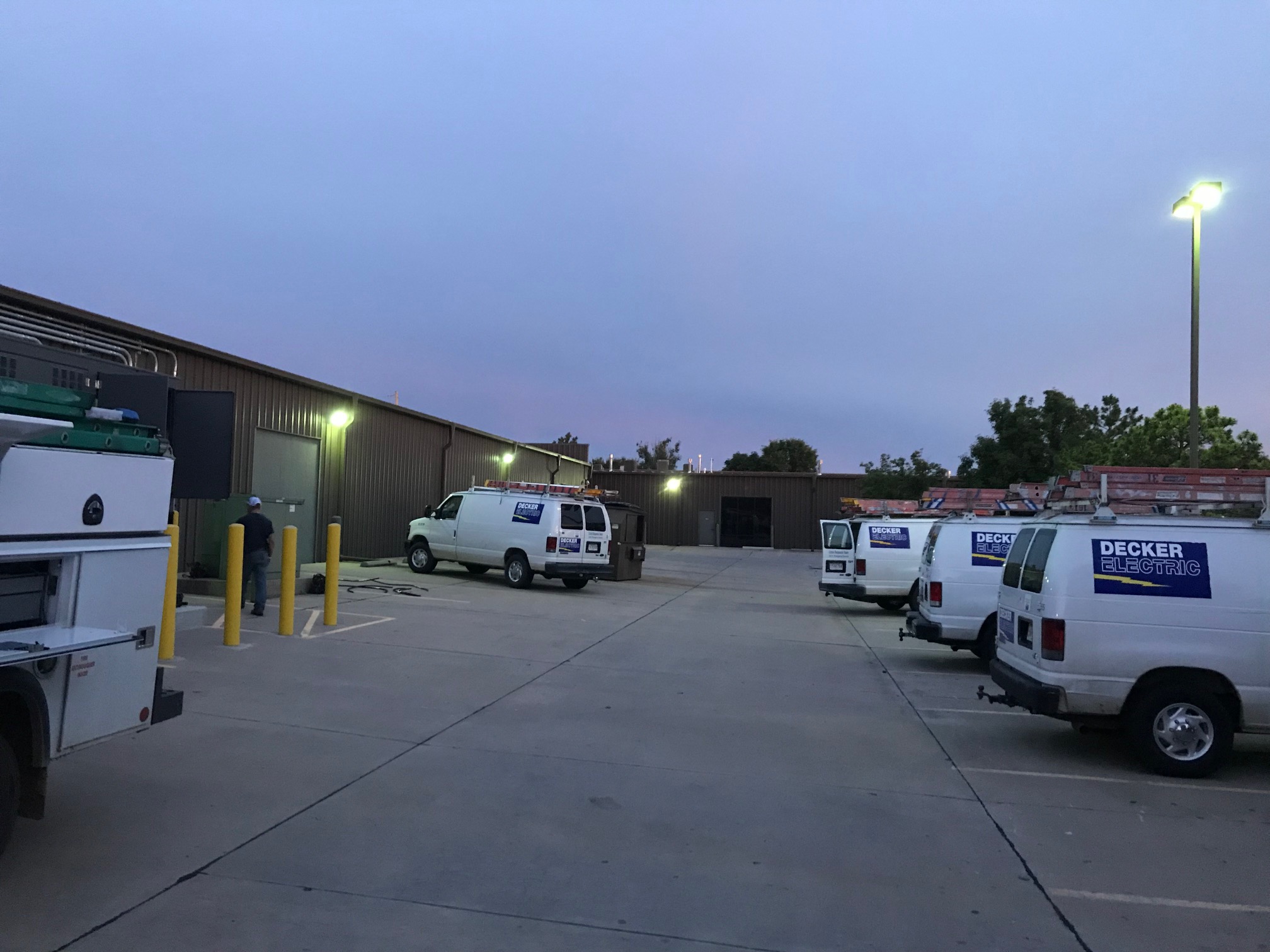 several Decker Electric vans sitting outside a local business in Wichita KS